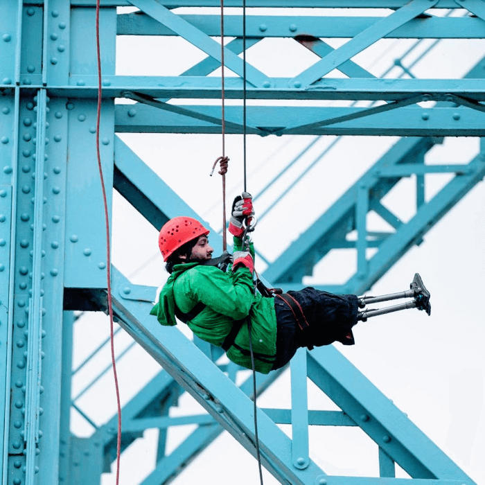 Person climbing a large structure