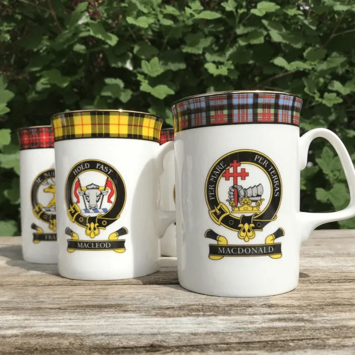 3 mugs with clan logos on them